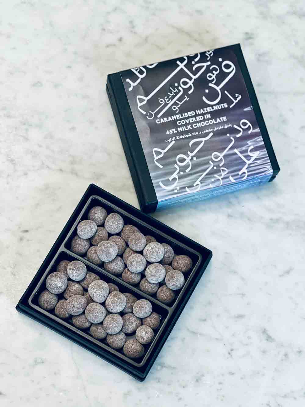 Caputos_Mirzam-Salty-Pearls_-Caramelized-Hazelnuts-in-45%-Salted-Milk-Chocolate-Top-Styled-For-WEB